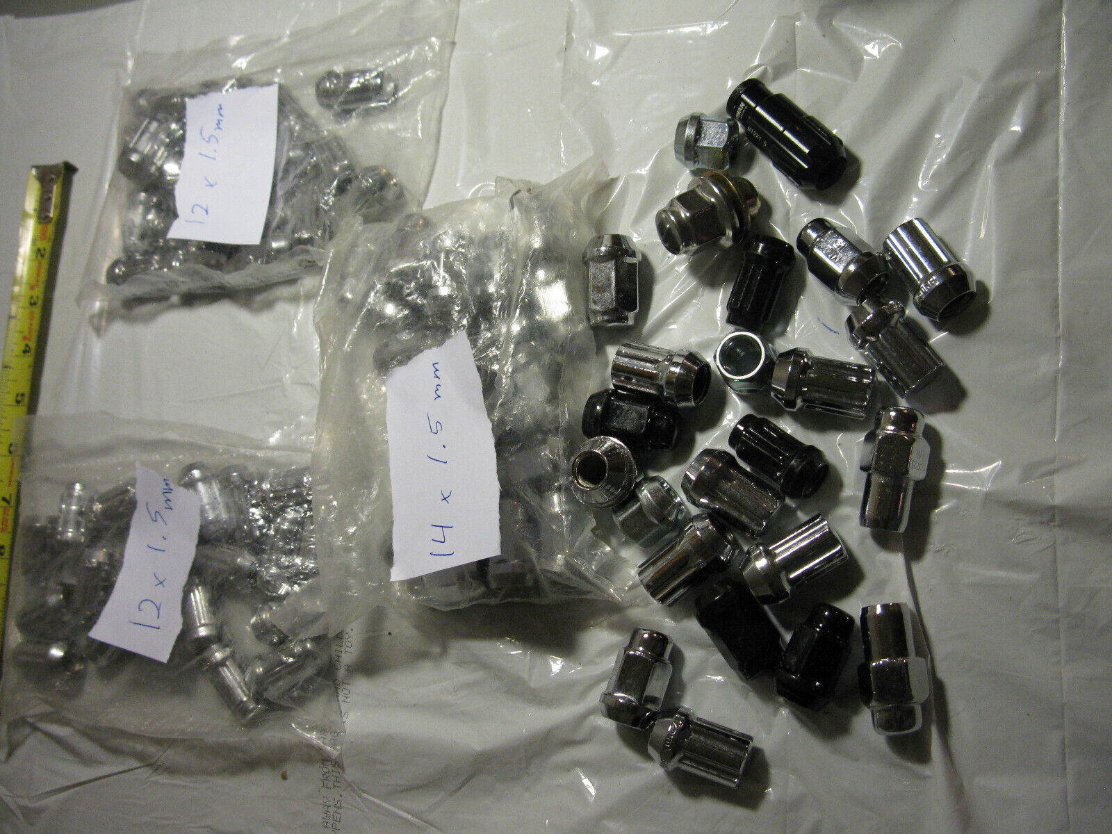 (image for) metric lug nuts lot - Click Image to Close